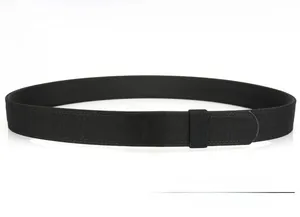 Close-up of black tactical belt with quick release metal buckle and woven nylon texture