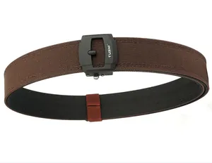 Detail of a brown woven canvas belt with a black matte buckle and TUSHI logo branding