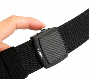 Detail showing tactical nylon belt buckle with carbon fiber texture and release button