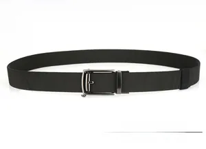 Detail of black woven nylon belt featuring a gunmetal grey automatic metal buckle system