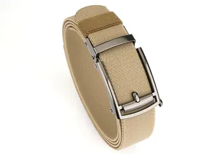 Detail of khaki elastic nylon belt with gunmetal automatic buckle and brown tip