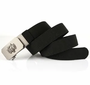 Detail of black elastic nylon belt with dragon relief on silver metal buckle