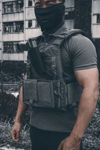 Detail of tactical vest featuring durable MOLLE webbing and quick-release buckle system
