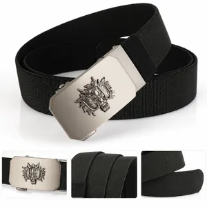 Macro detail of men's belt showing 3D dragon buckle and black elastic woven fabric