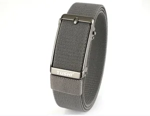 Detail of grey stretch woven belt with gunmetal automatic buckle and TUSHI logo