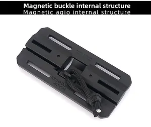 Macro detail of black tactical magnetic buckle with pull cord for gear adjustment