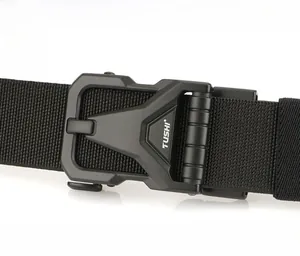 Detail of black tactical belt buckle featuring quick-release zinc alloy mechanism