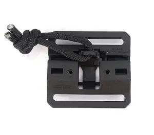 Detail view of black polymer tactical buckle with paracord for outdoor gear extension