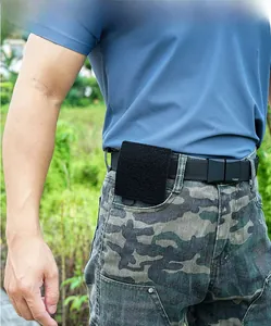 Tactical molle system base with hook and loop fasteners on black utility belt