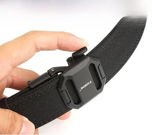 Detail of hand operating a black tactical nylon belt with matte quick-release buckle
