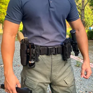 Close-up of tactical nylon belt featuring metal quick-release buckle and multi-pouch system