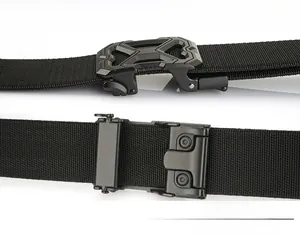 Detail of the automatic buckle mechanism on a black tactical nylon web belt