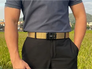 Tactical nylon belt in khaki with black metal quick-release buckle shown outdoors