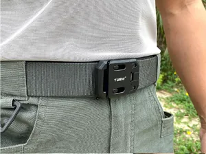 Close-up of TUSHI tactical belt with quick-release buckle on military trousers
