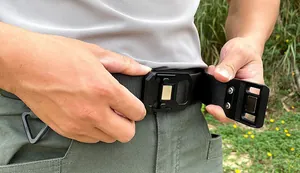Tactical nylon belt detail showing quick-release magnetic buckle and D-ring attachment