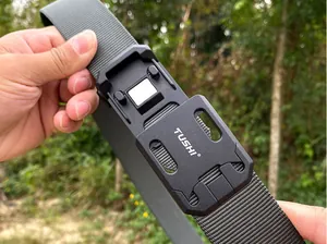 Close-up of tactical nylon belt with quick release buckle featuring a magnetic mechanism