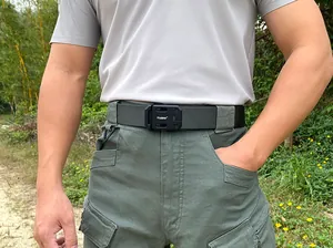 Tactical nylon belt detail featuring quick-release metal buckle in outdoor setting