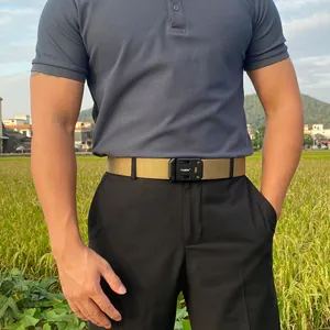 Tactical nylon belt with matte black quick-release buckle shown in outdoor scenery