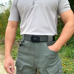 Close-up of tactical nylon belt with quick-release buckle worn on outdoor cargo pants