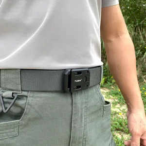 Detail of grey tactical nylon belt with black buckle on olive cargo pants