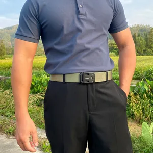 Close-up of tactical nylon belt with matte black metal buckle worn by a male model