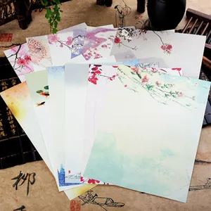 Detailed view of Chinese style envelopes featuring floral and goldfish illustrations
