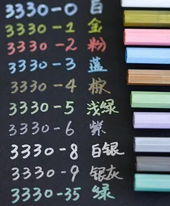 Macro display of 10 metallic paint markers showing vibrant colors on black paper background