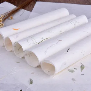 Detail of 5-roll set handmade flower paper with natural petals and grass fibers