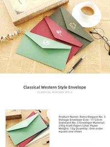 Close-up of vintage DL envelopes with gold foil patterns and elegant writing accessories