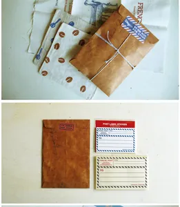 Detail of vintage kraft envelope set with cotton coasters and postal label stickers