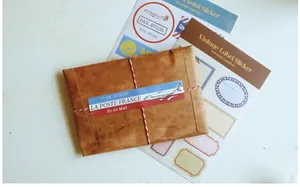 Detail of vintage kraft envelope with airmail labels and retro decorative stickers
