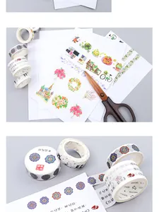 Detail of vintage washi tape rolls and decorative paper scraps for DIY scrapbooking