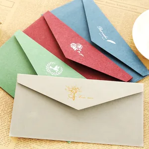Retro multi-colored envelopes with gold foil stamping on textured artistic paper