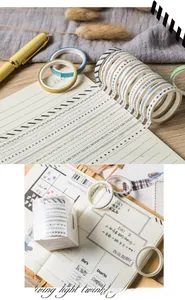 Macro detail of aesthetic washi tape set with minimalist black and white patterns on a notebook