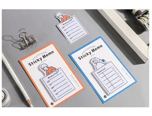 Detail of weekly plan and checklist memo pads with orange and blue illustration style