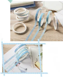 Macro detail of ocean themed washi tape set featuring blue wave patterns for DIY journaling