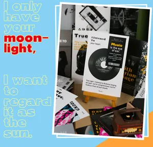 Close-up of artistic vinyl record postcard with wooden easel and mini record player model