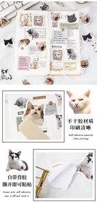Close-up of cat stickers showing clear printing and adhesive backing for DIY journaling