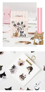 Close-up of cute cat stickers with pink box for DIY scrapbooking and journal decoration