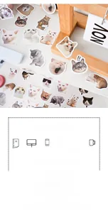 Detailed view of cute cat meme stickers applied on a notebook and wooden calendar stand