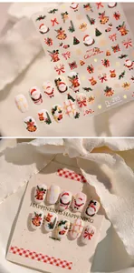 Detail view of TL-295 Christmas nail stickers featuring Santa Claus and tree motifs