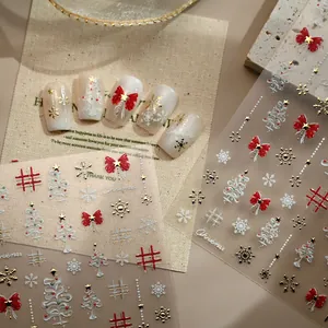 3D Christmas nail art stickers with red bows, snowflakes and gold embossed patterns