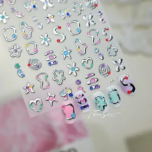 Detailed view of silver 3D star nail art stickers with colorful dots on various nails
