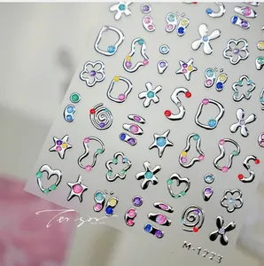 Detailed view of silver glittery 3D embossed nail stickers with stars and hearts