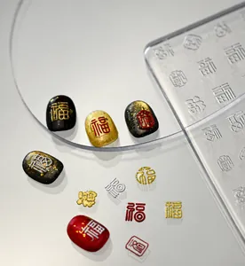 Macro shot of 3D silicone nail art mold featuring traditional Chinese character patterns