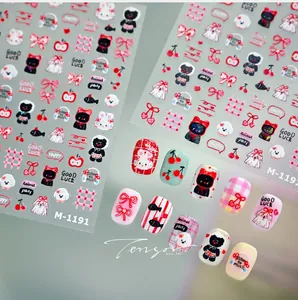 Detailed view of cartoon bunny nail art stickers with cherry and bow patterns