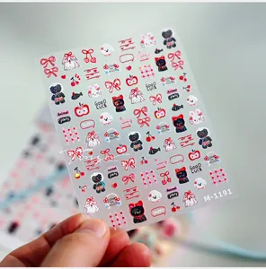 Macro detail of M-1191 nail art stickers featuring cute bear and puppy designs