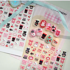 Detail of cartoon girl-style nail stickers with animal motifs and cherry patterns