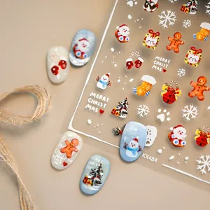 Adesivi per unghie natalizi con pupazzo di neve e motivi di Babbo Natale decorati