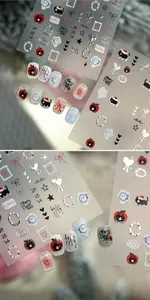 Detailsicht der Weihnachts-Nagelaufkleber mit schwarzer Katze, Schneemann und Apfel